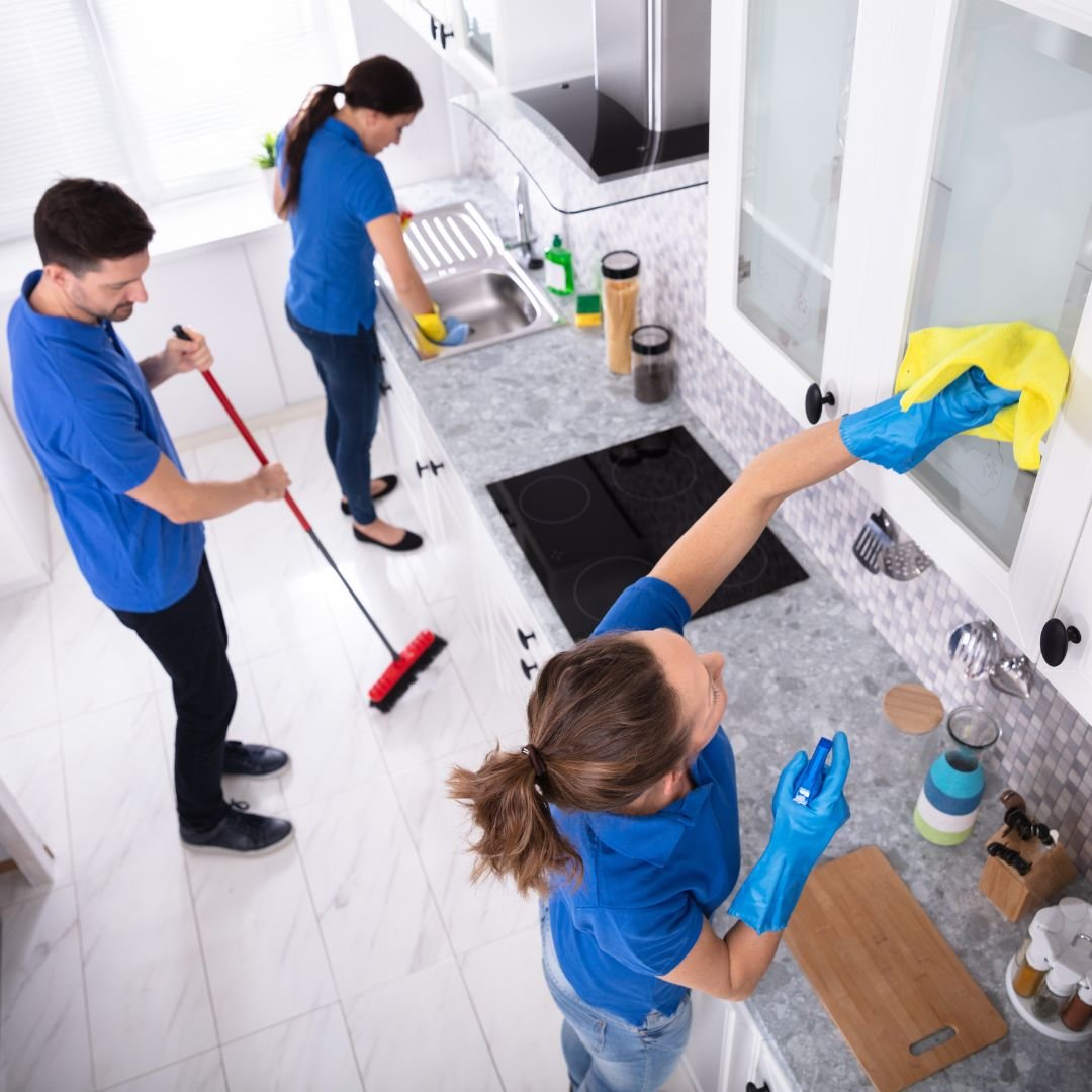 Cleaning company cleaning kitchen together